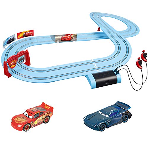 Carrera First Disney/Pixar Cars - Slot Car Race Track - Includes 2 Cars: Lightning McQueen and Jackson Storm - Battery-Powered Beginner Racing Set for Kids Ages 3 Years and Up, Blue/Red/Navy